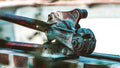 a close up of a metal object on a brick wall
