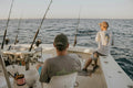 two men doing fishing during daytime
