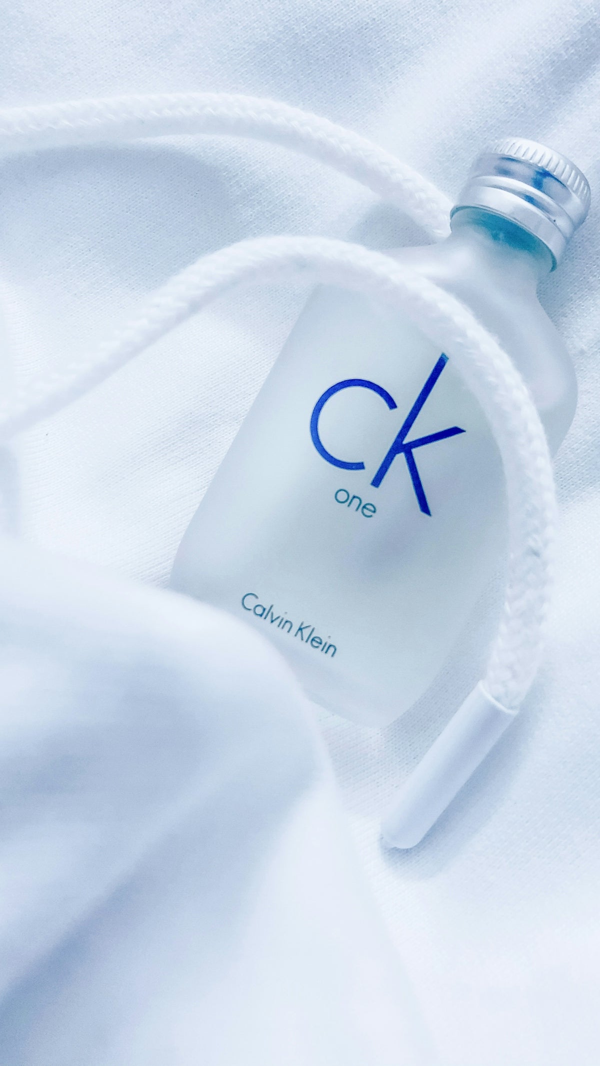 CK One fragrance bottle from Calvin Klein on a white background.