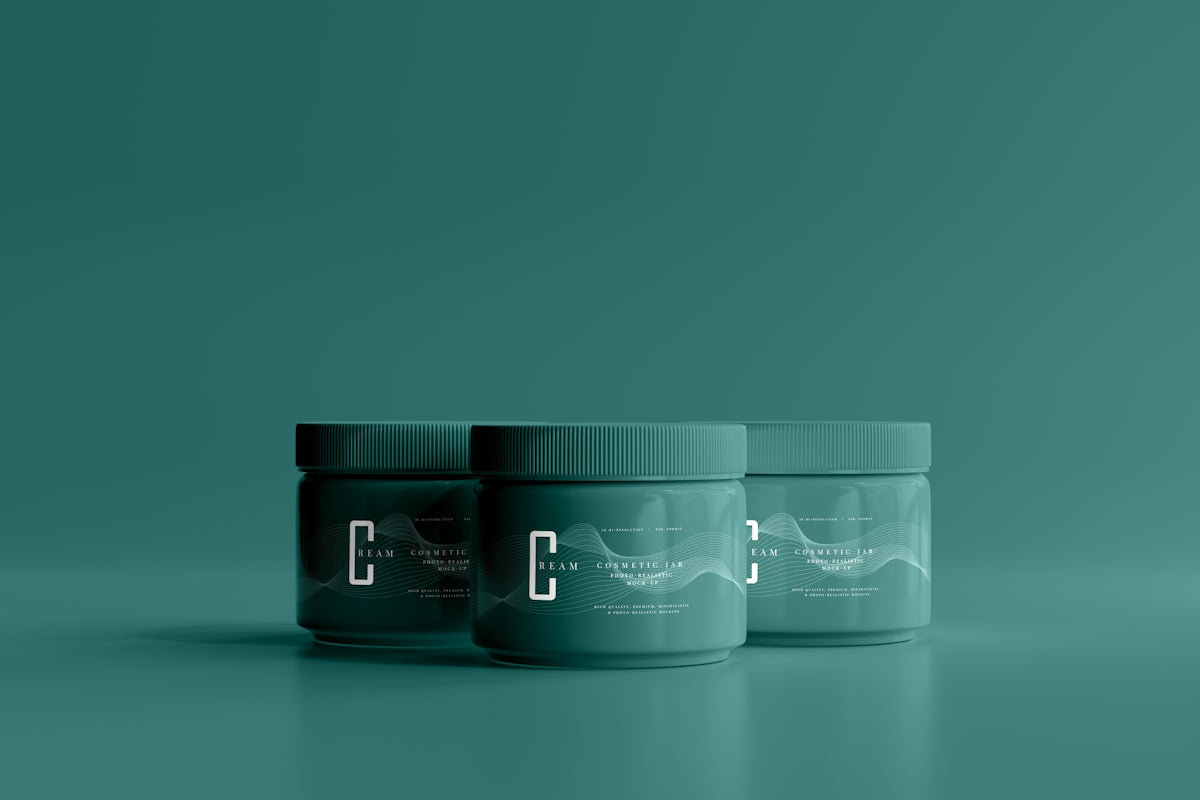three jars of toothpaste on a green background