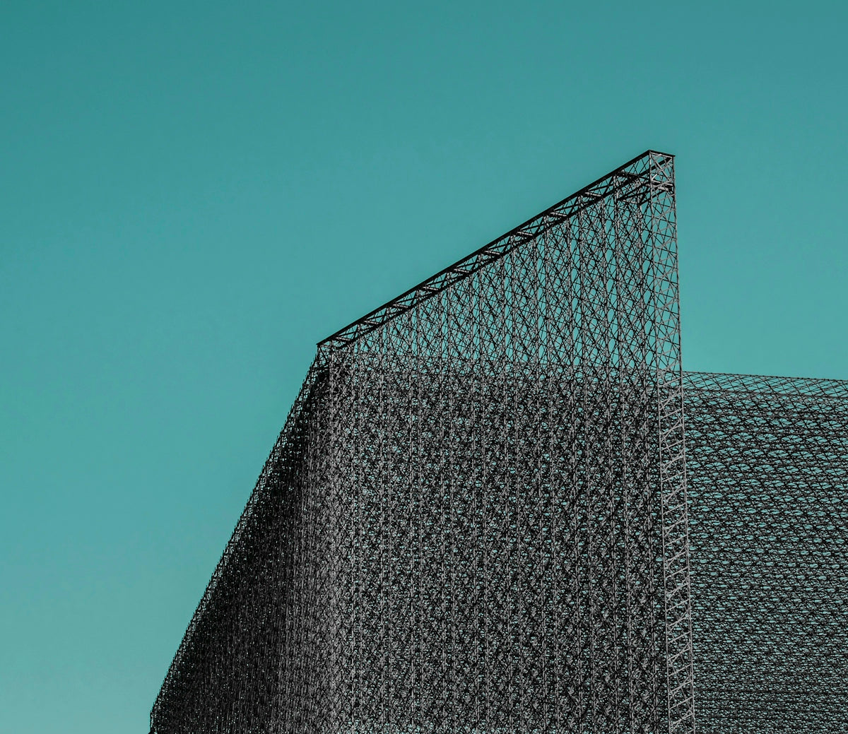 a large metal structure with a triangular roof