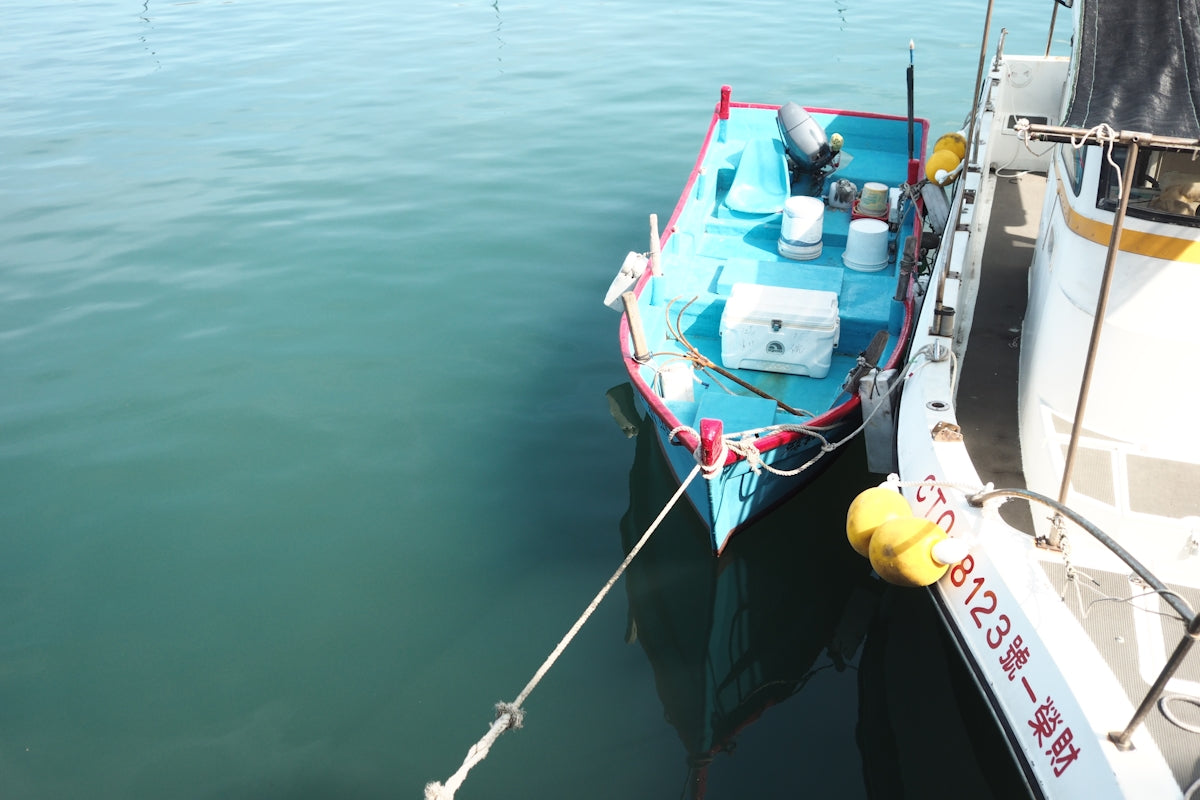 The 20m 30m 40m Set Net Buoy-Anchor Combo on a fishing boat in calm waters.