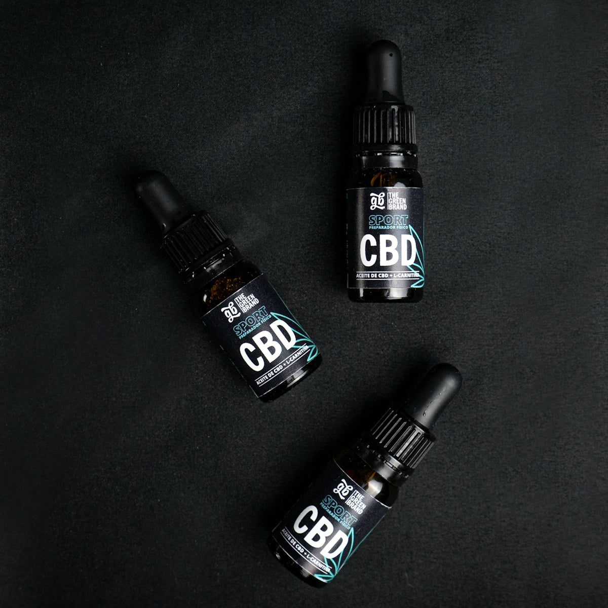 Three bottles of cbd sitting next to each other