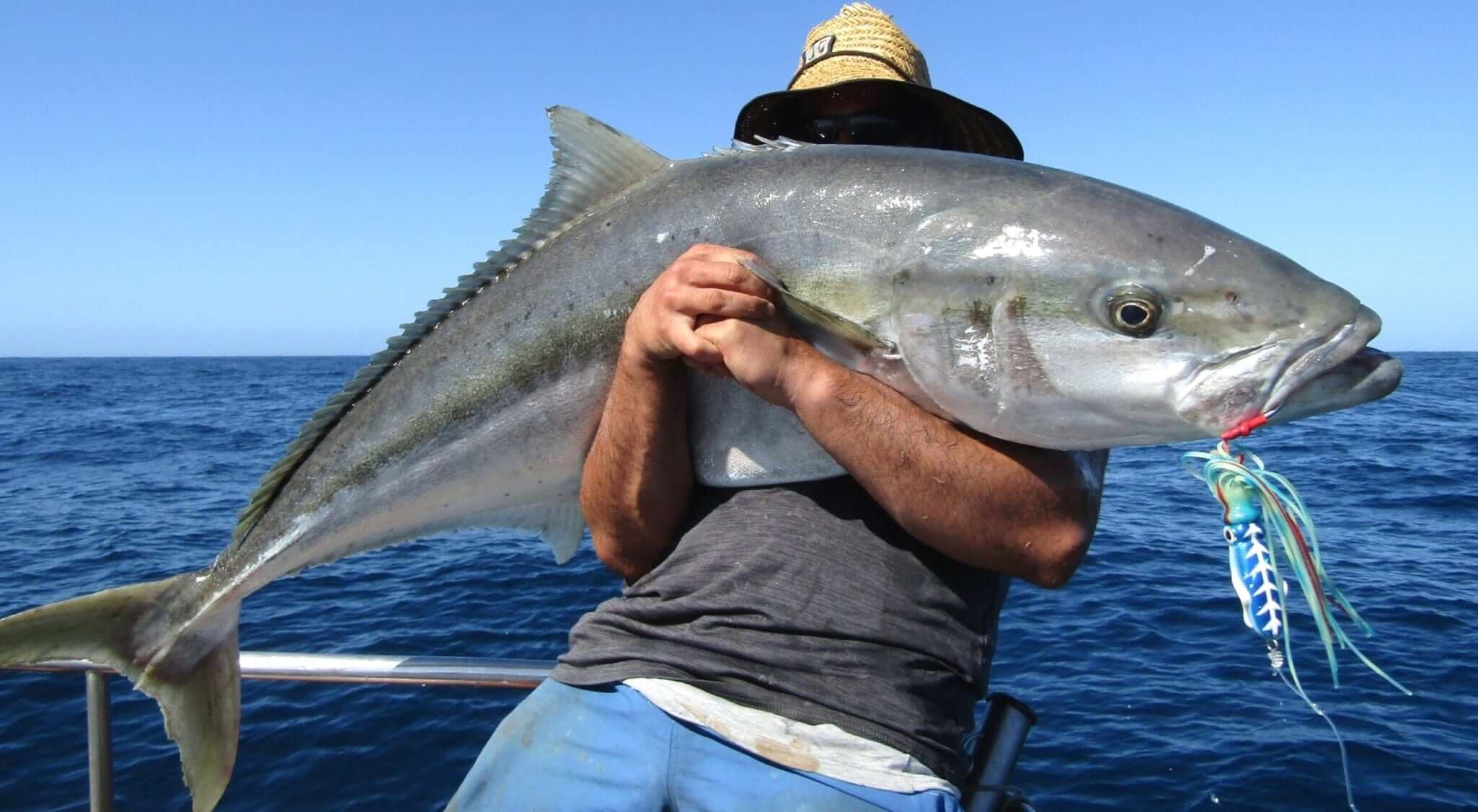 Man holding a large kingfish, 42KING-EDITED
