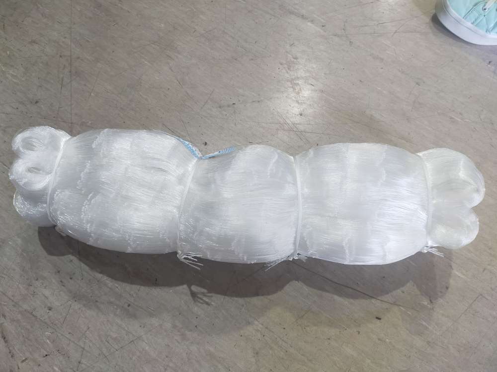 4.5 Inch 0.50mm 25md unslung Mesh 115MM X 120M roll viewed from above, showcasing the fishing net material.