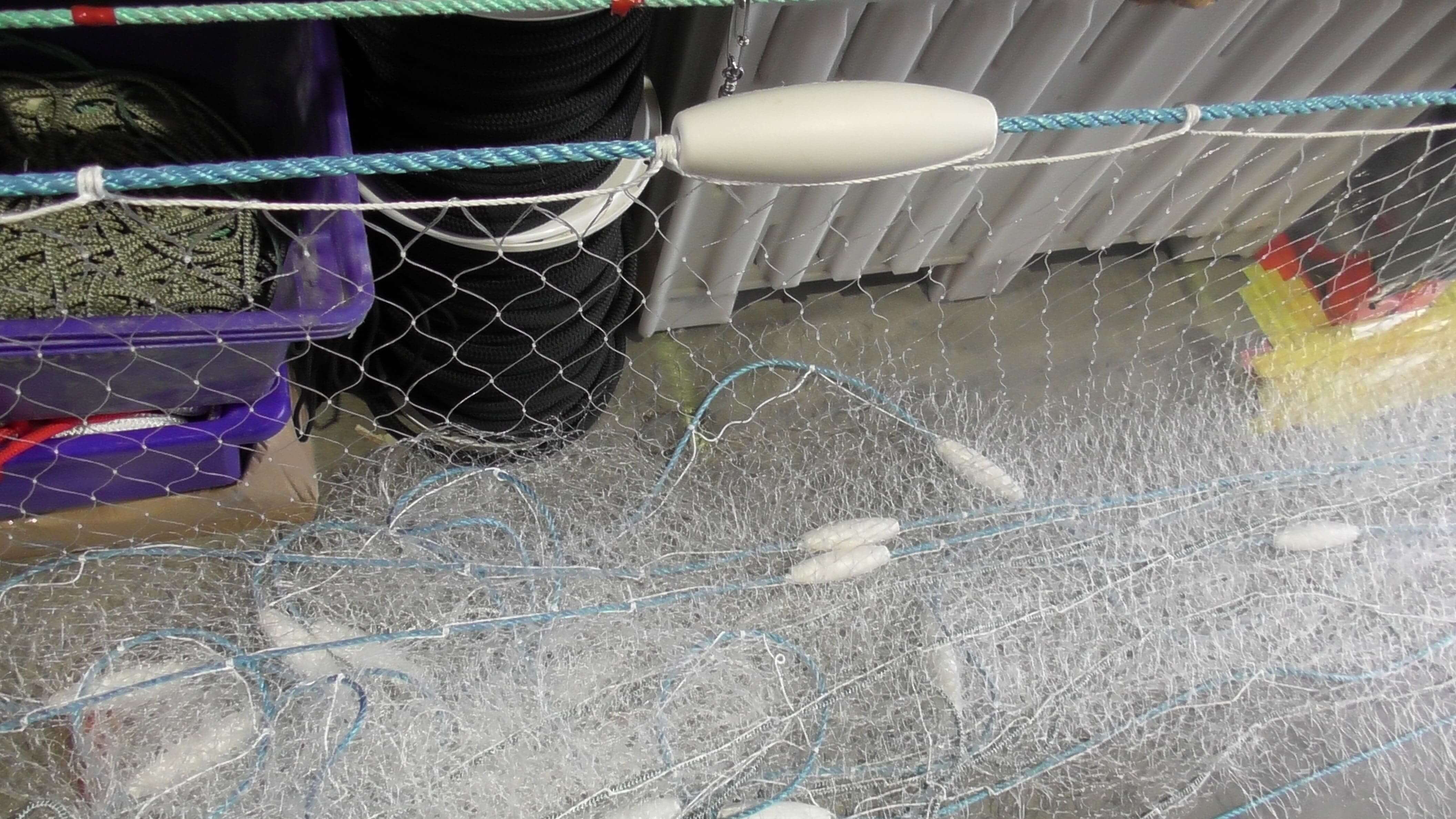 500m Commercial Mullet Fishing net with whisper floats and lead core rope displayed in a fishing setup.