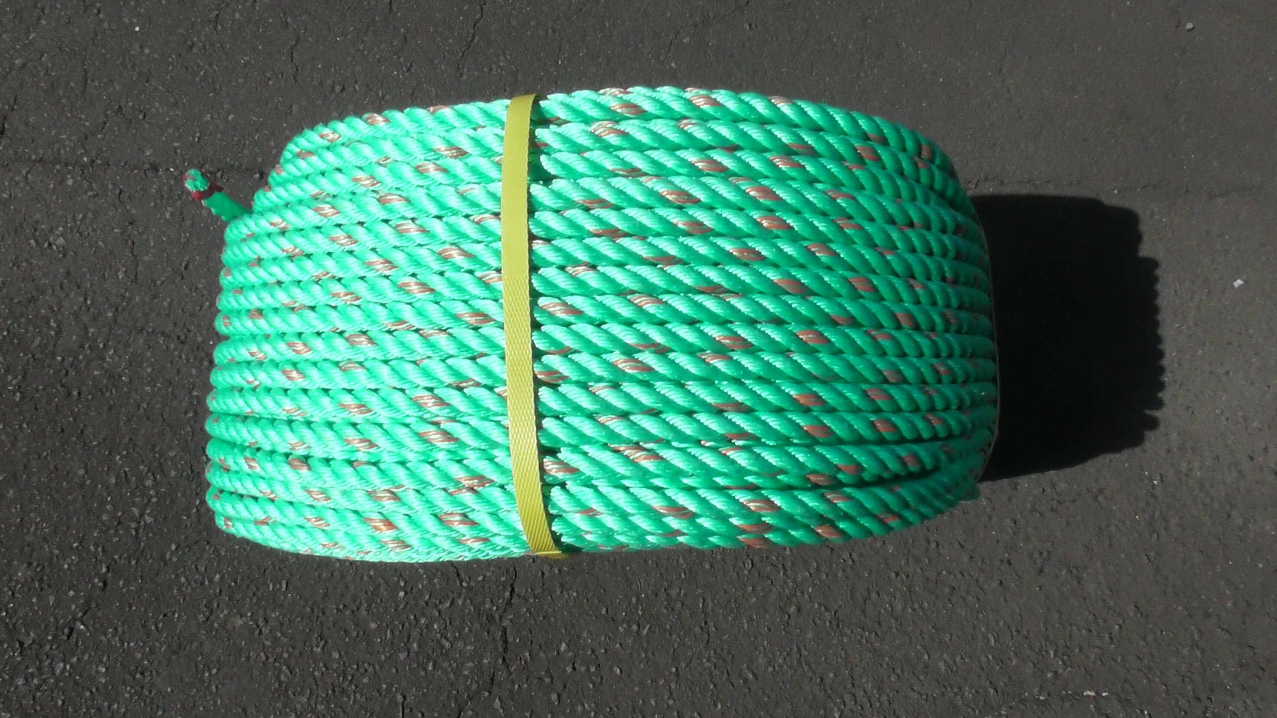 Green Polypropylene rope 12mm x 220m Coil for heavy-duty tasks, showcasing its durable and secure design.