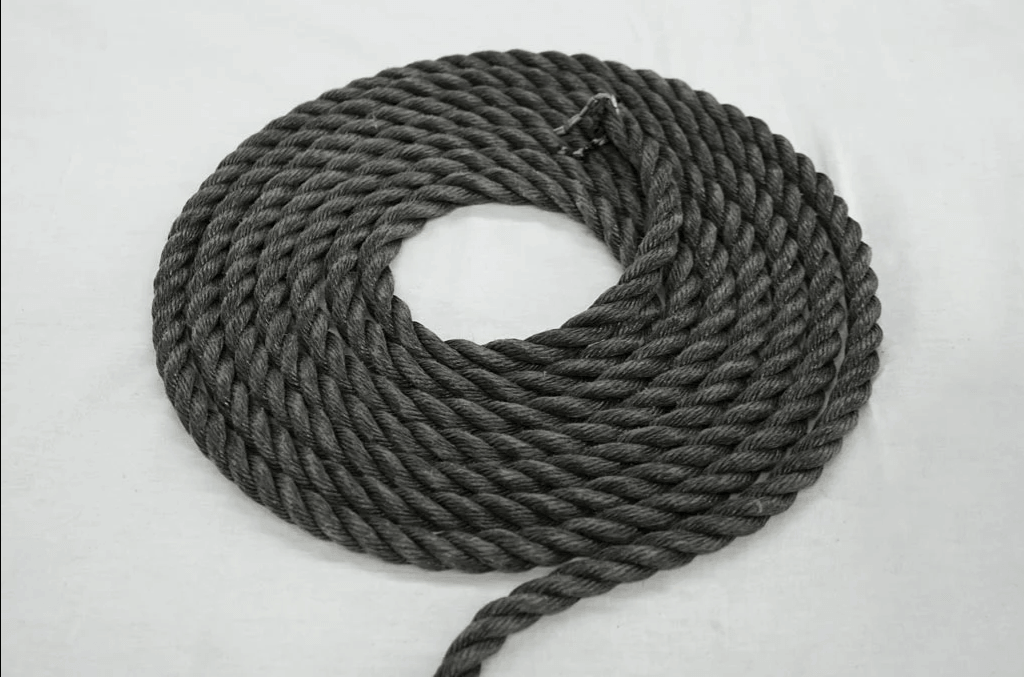 6mm Black Marine Rope coiled neatly, ideal for marine and industrial applications, showcasing strength and durability.