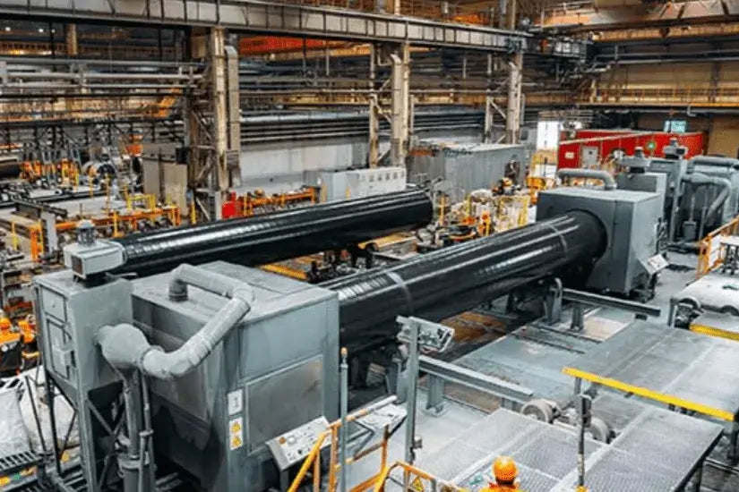 Industrial factory interior with large machinery and equipment.