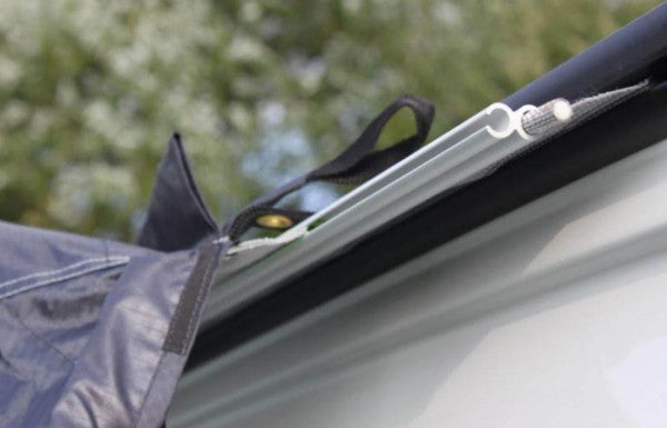 Vango drive away kador strip attached to an awning on a campervan, showcasing its ease of use.