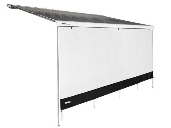 Thule Front Sunblocker 3.8m Long attached to an awning, providing shade while allowing airflow.