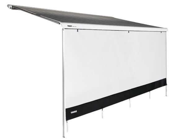 Thule Front Sunblocker 3.8m Long attached to an awning, providing shade while allowing airflow.