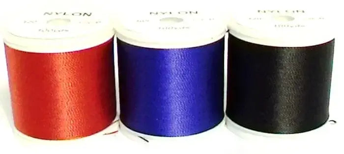 Binding Thread 400 Yds Red Colour spools with red, purple, and black nylon threads displayed.