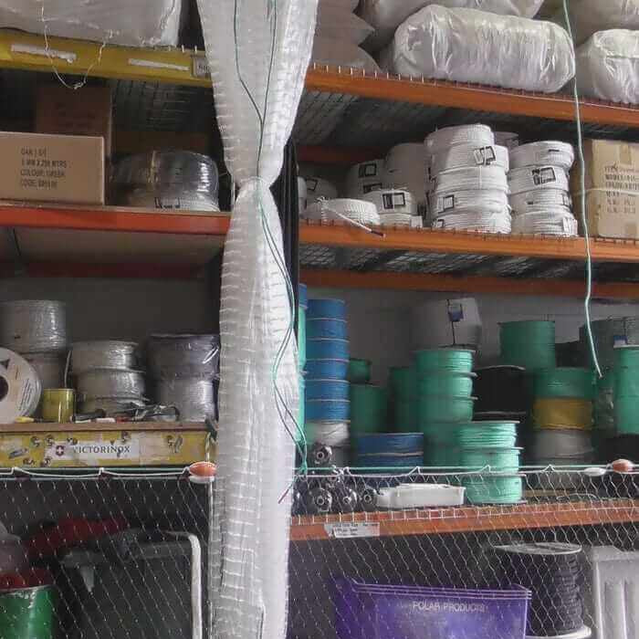 Heavy Duty Pacific Island Nets in Marine Applications displayed in a storage area with various marine supplies.
