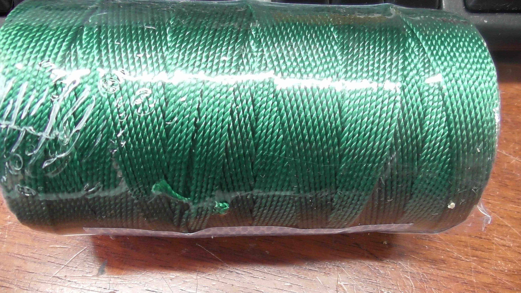 Green Repair Twine Essential Techniques for Better Results displayed on a spool of green twine.