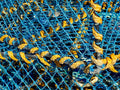 close-up of a 4mm braided lead core rope interwoven with blue and yellow strands, showcasing its durability and texture