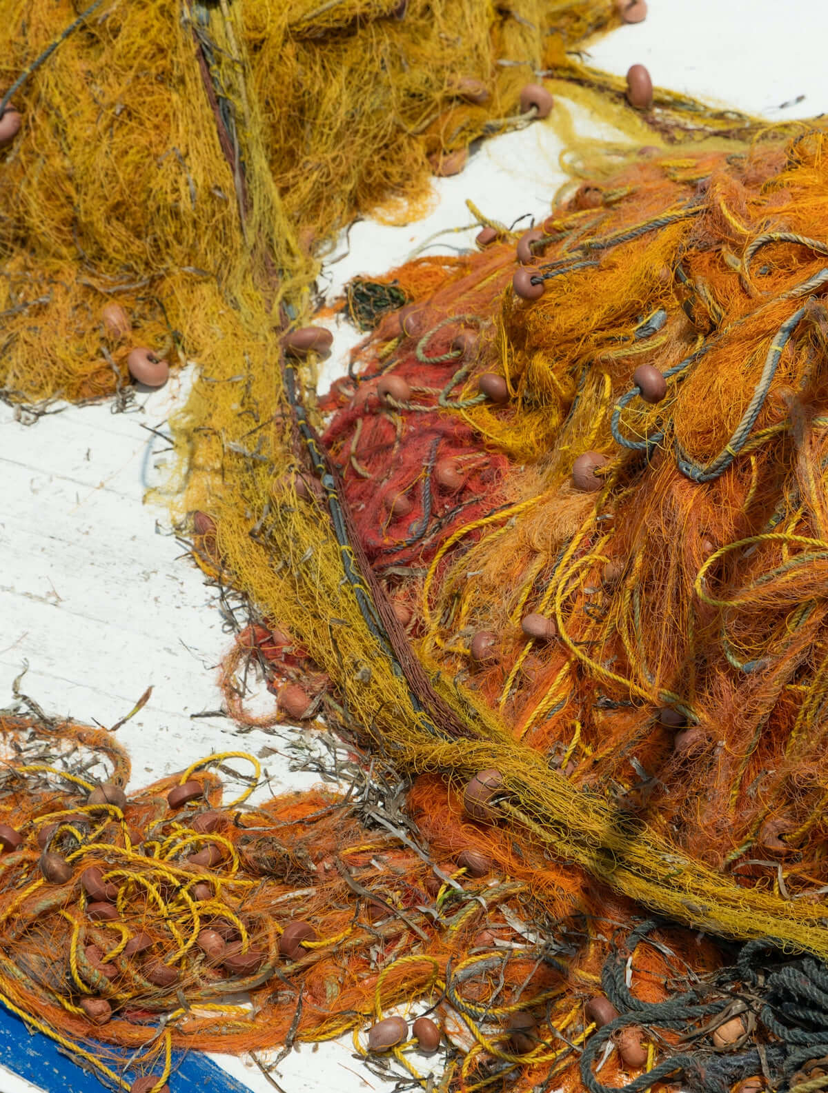 Pile of tangled fishing nets with floats