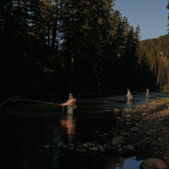 photo of man fishing on lake