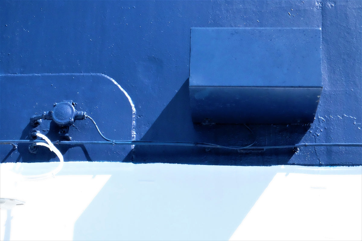 Angling Precision Bluewater Minnow 160mm Blue Laser on a blue and white wall with shadowing.