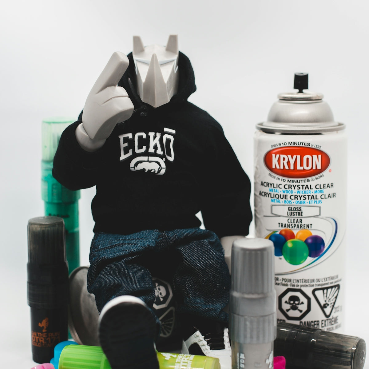 Exploring Different Types of CRC Products for DIY Enthusiasts - figure with spray paint cans and graffiti supplies.