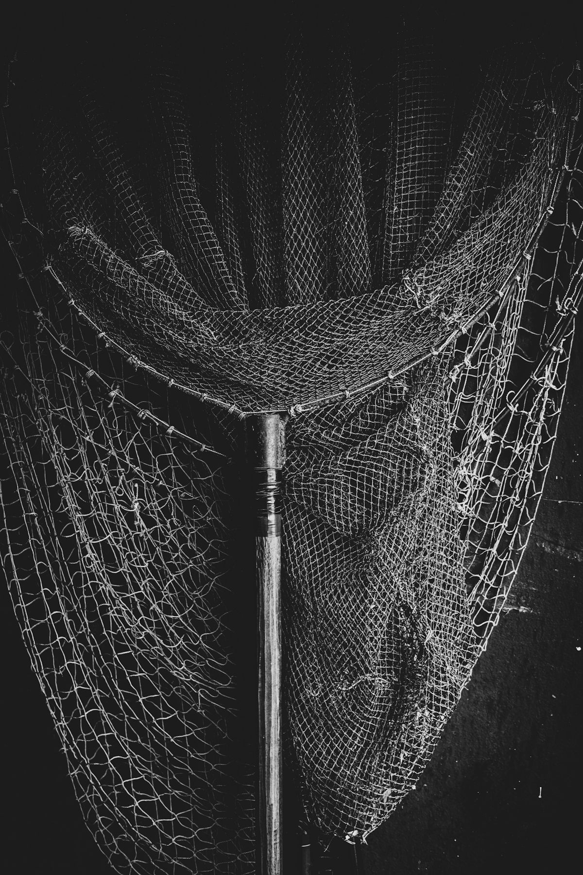 Fishing Nets with 3 Inch 0.50mm x 36MD Pacific Island Mesh hanging in a black and white photo.