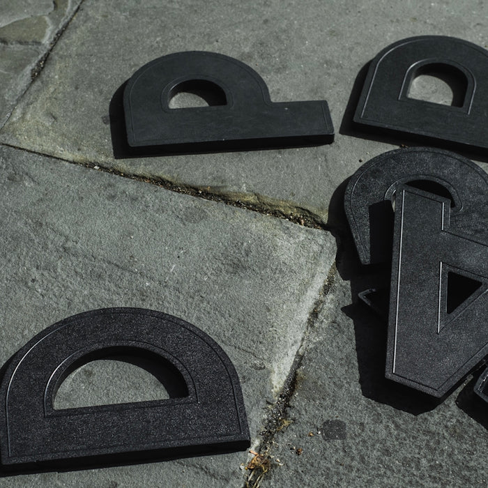 black plastic tool on gray concrete floor
