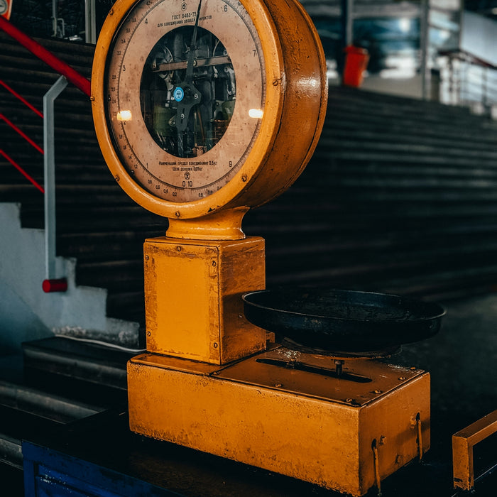yellow and black weighing scale