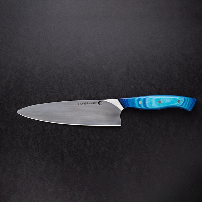 red handled knife on black surface