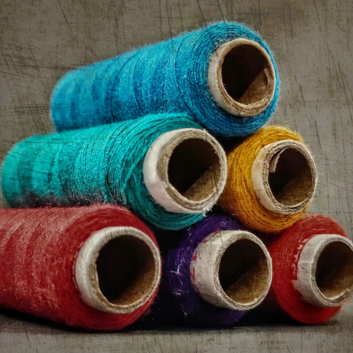 blue red and yellow thread rolls