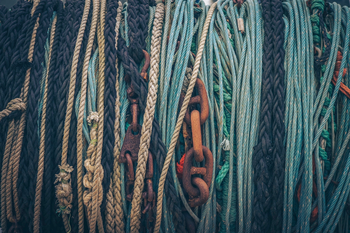 blue and white rope on brown metal bar