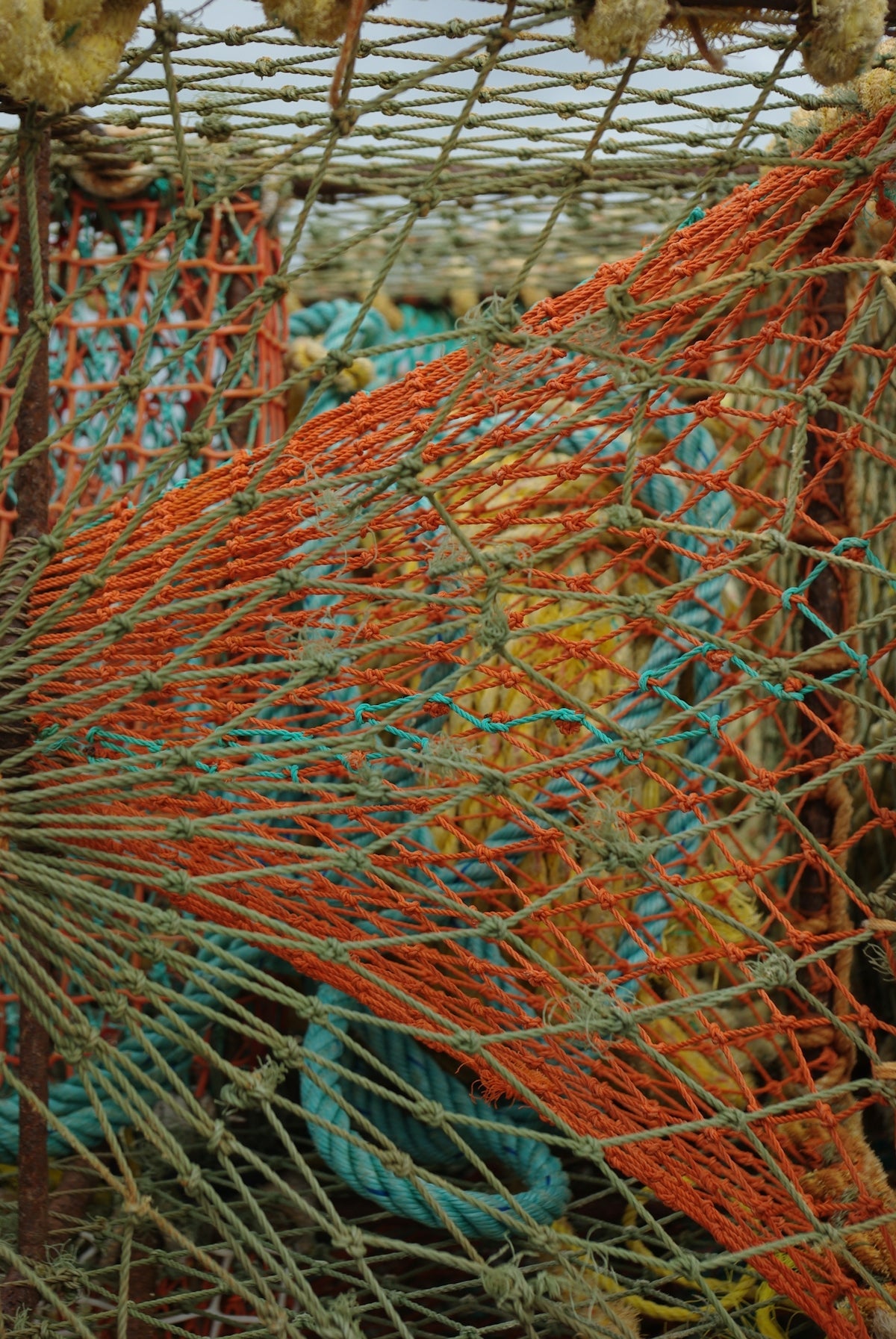 Understanding the Benefits of 2.1mm Copper Crimps with colorful fishing nets in the background.