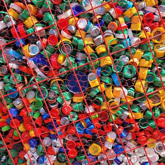 a large amount of plastic bottles in a cage