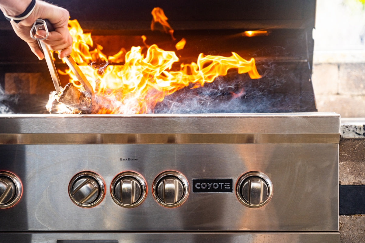 a person putting food in a grill