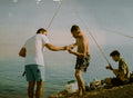 a group of men fishing