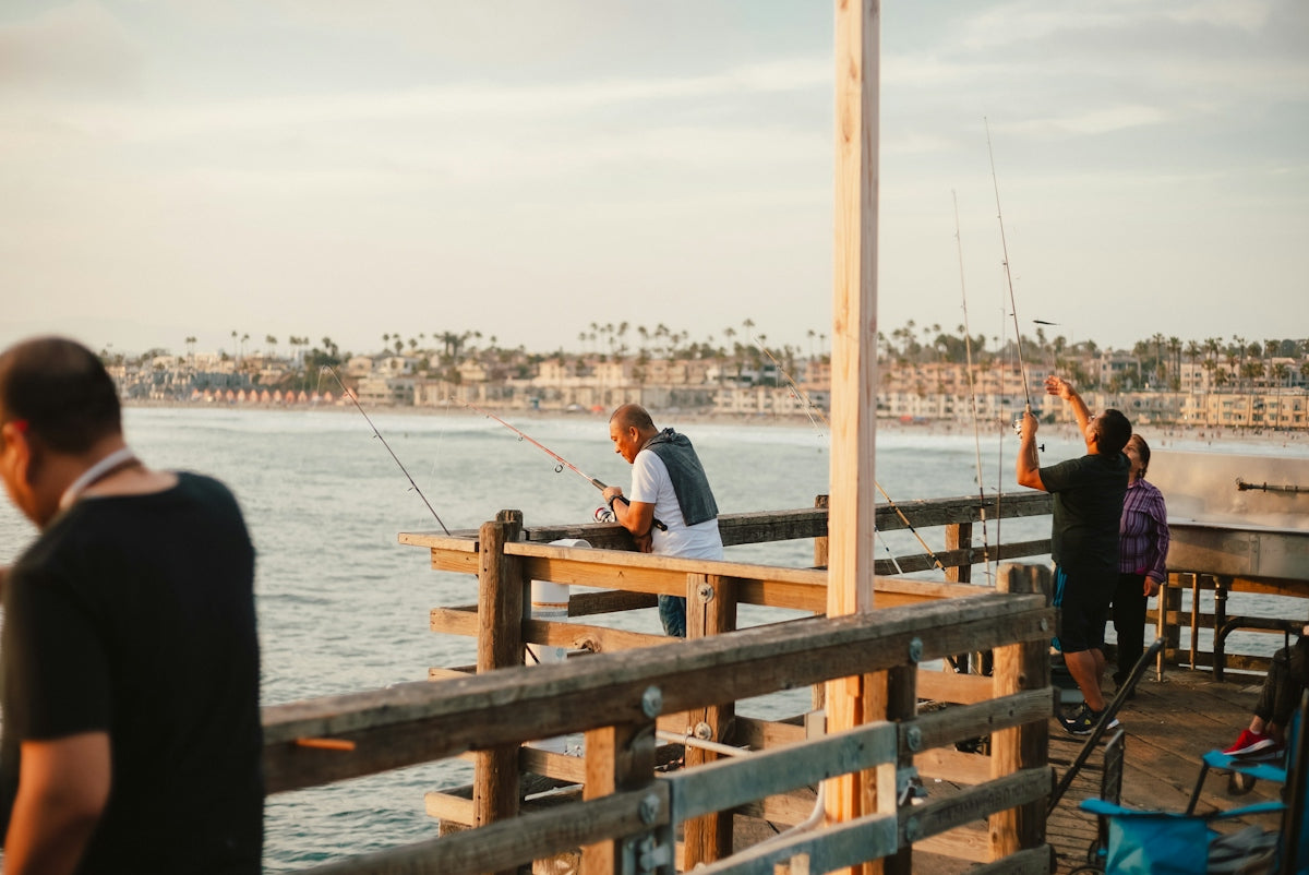 a group of people on a pier fishing
