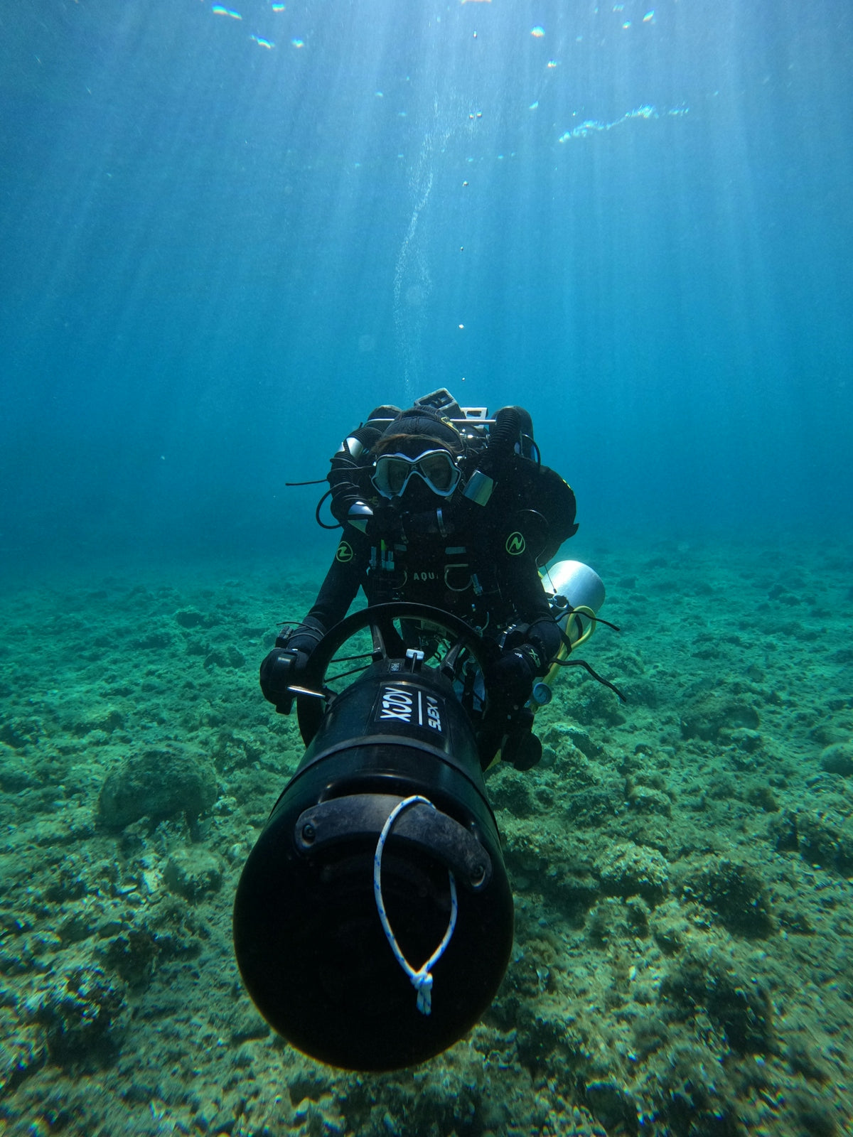 a man in a scuba suit is underwater