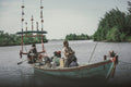 a group of people on a boat in the water