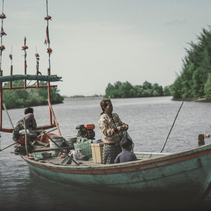 a group of people on a boat in the water