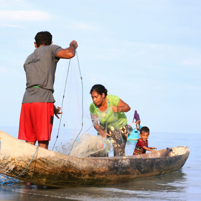 a group of people on a boat in the water