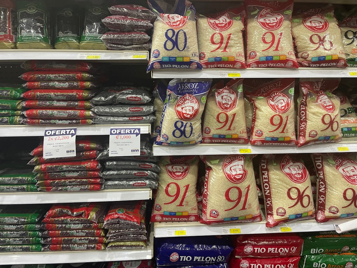 A Comprehensive Checklist for Using CRC Products Effectively displayed on rice bags in a supermarket aisle.