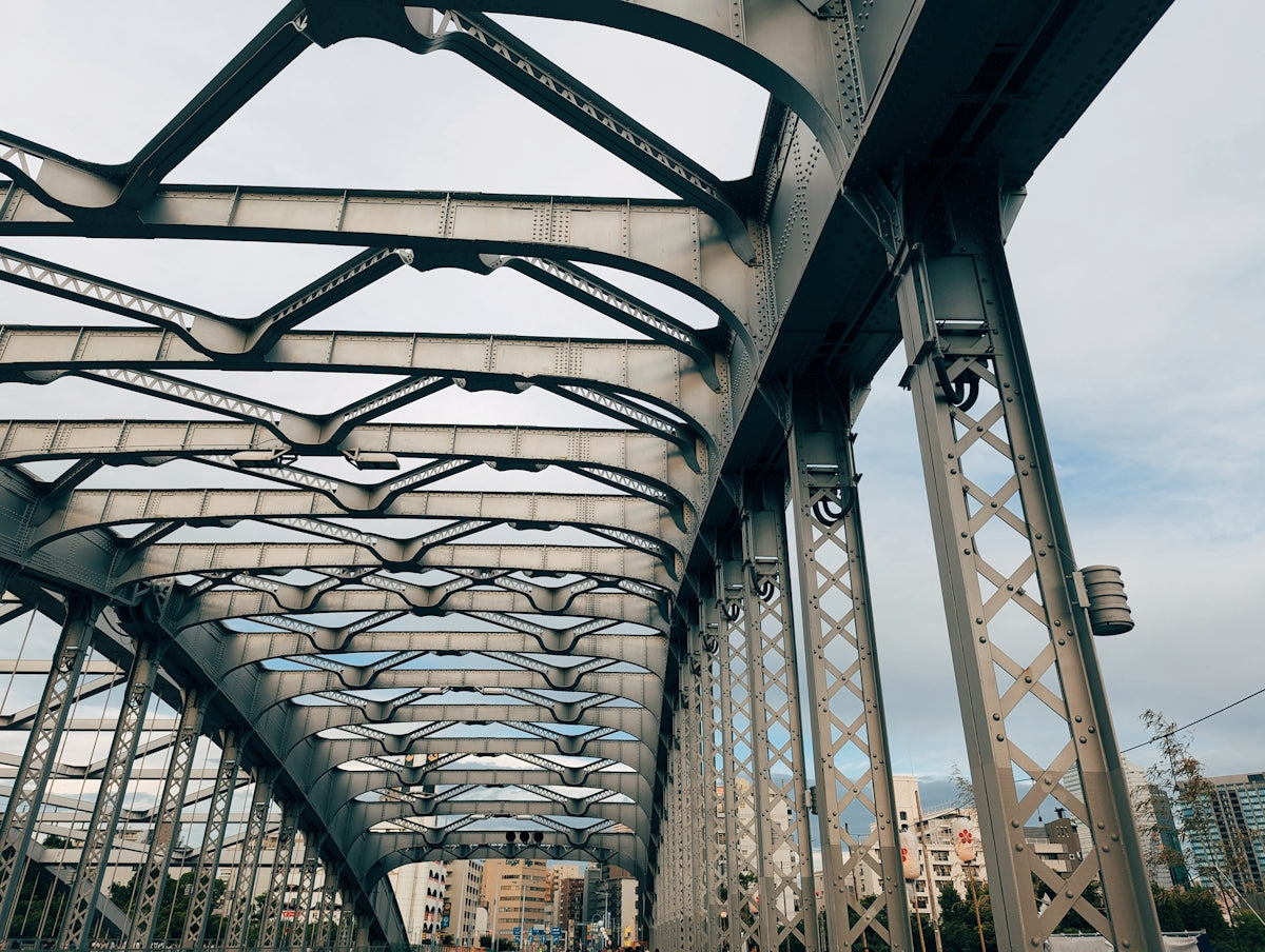 A view of a bridge from the ground