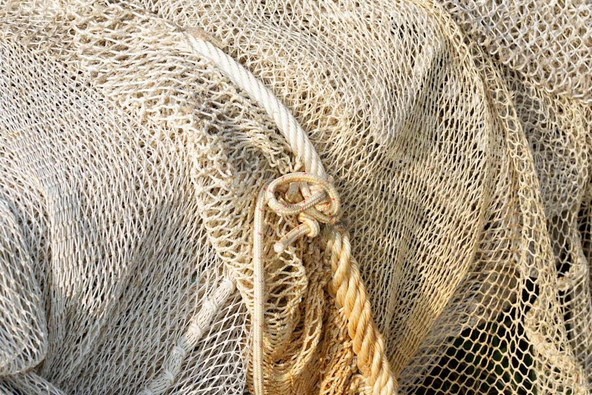 Close-up of 4 inch 0.7mm mesh nets used for fishing in Pacific Islands, showcasing the netting structure.