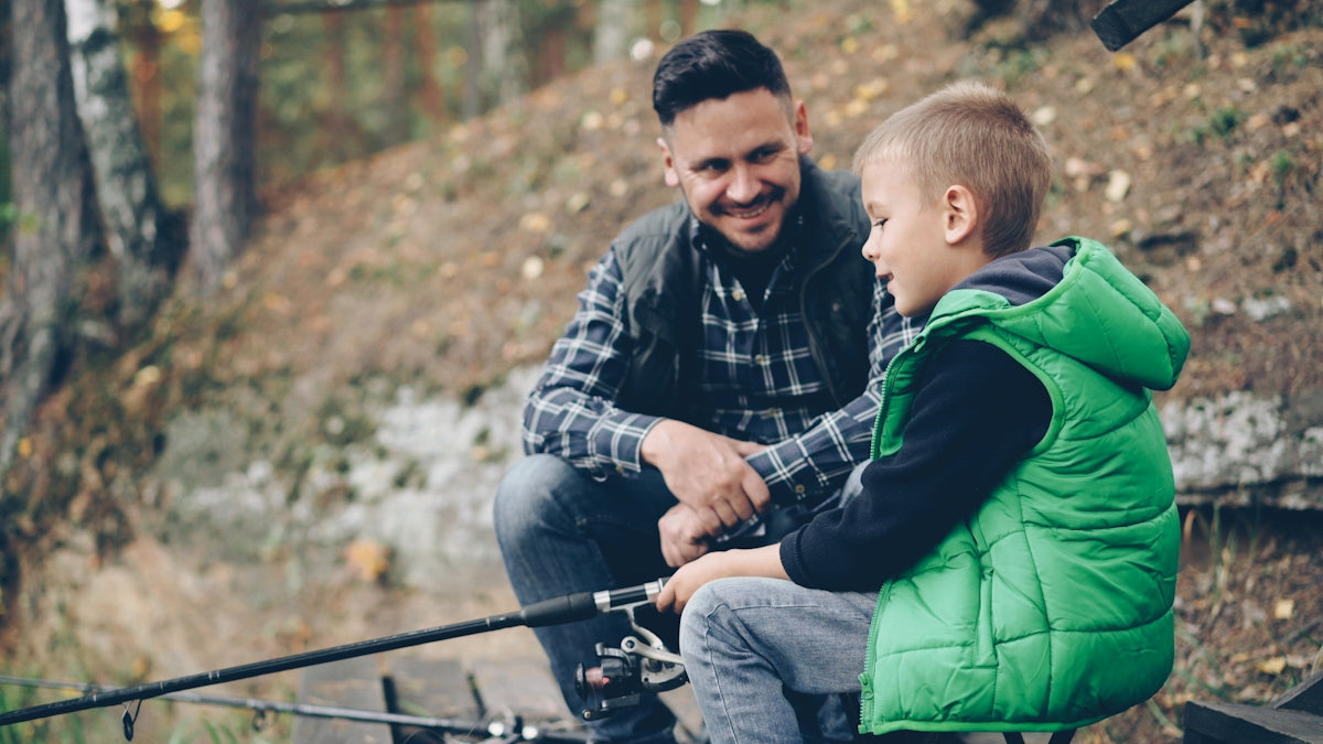 Father and son are enjoying a fishing trip