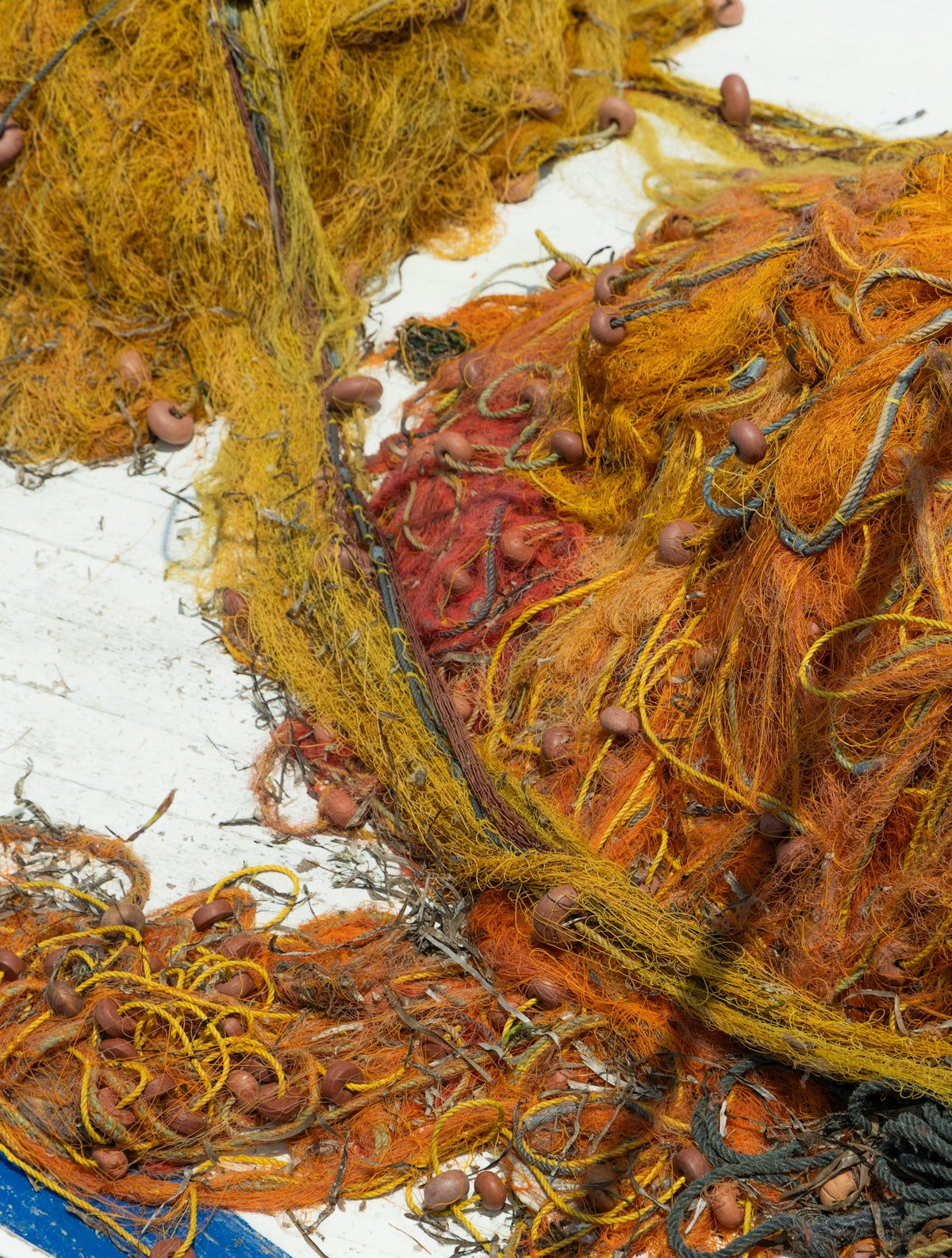 Pile of tangled fishing nets with floats