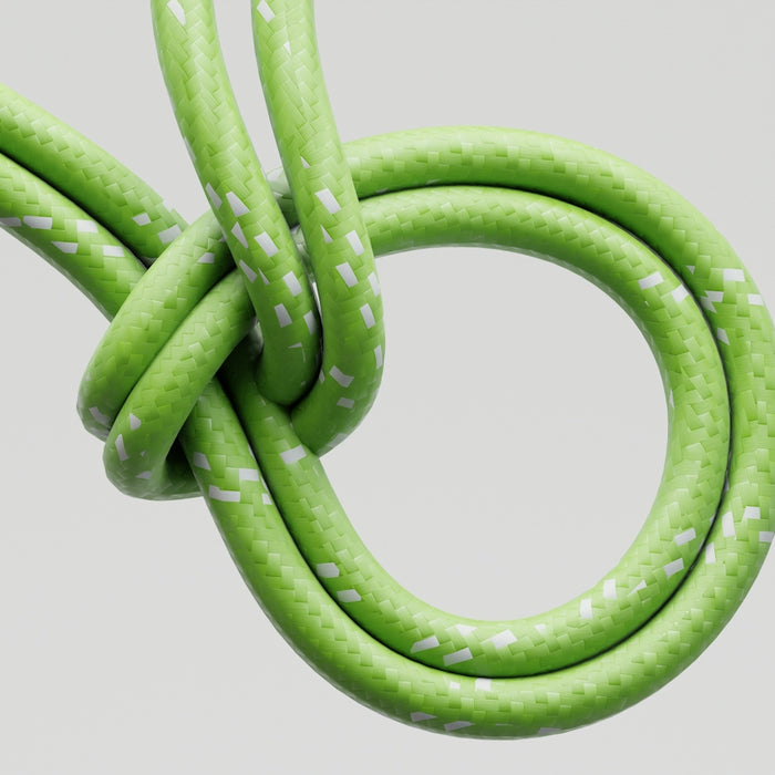 Green cord tied in a knot against white background