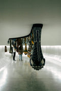 People observe hanging textile art installation