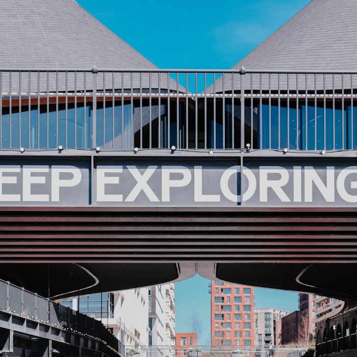 Keep exploring text on a bridge overpass
