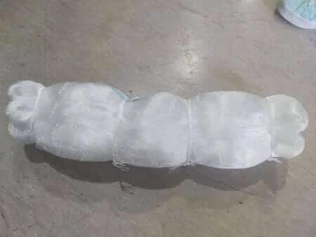 Unslung mesh 0.5mm x 65mm (2.5 inch) x 25MD x 245m packaged roll on a flat surface.