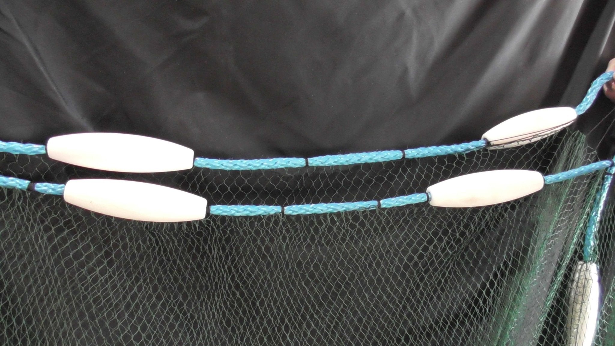 Close-up of 90m Commercial Floating Piper Net demonstrating premium floating buoys and strong mesh construction.