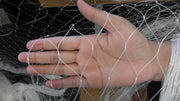 Hand holding Mullet Nets made with Multi Mono Mesh showcasing the fine mesh details for fishing.